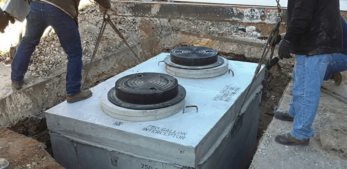 Grease trap installation for a commercial property drainage system in Bloomington, IN
